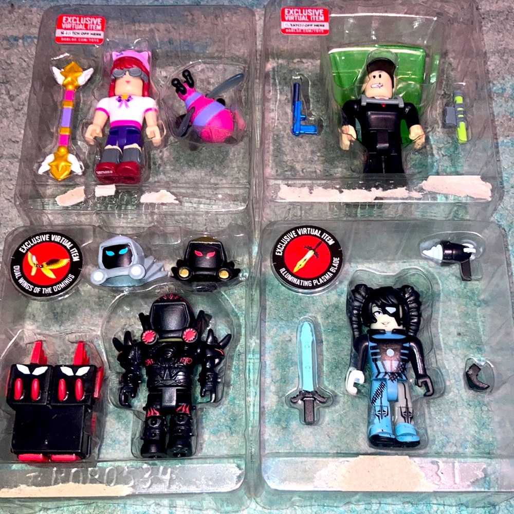 Four Roblox Figures with Exclusive Toy Codes